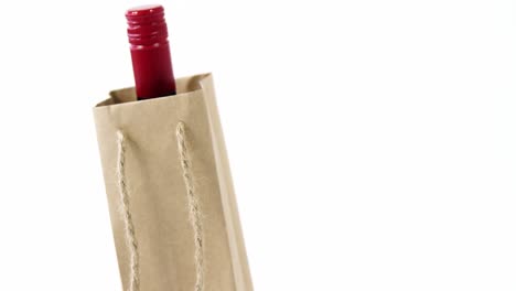 close-up bottle in paper bag