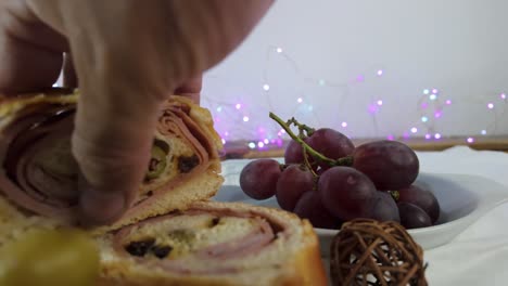 fresh grapes on a plate with blue lights in the background, close-up shot