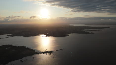 aerial view of a town on a lake at sunset