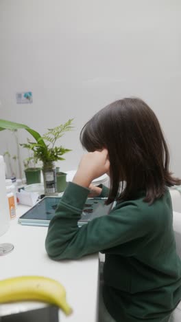 young girl using a tablet for digital art