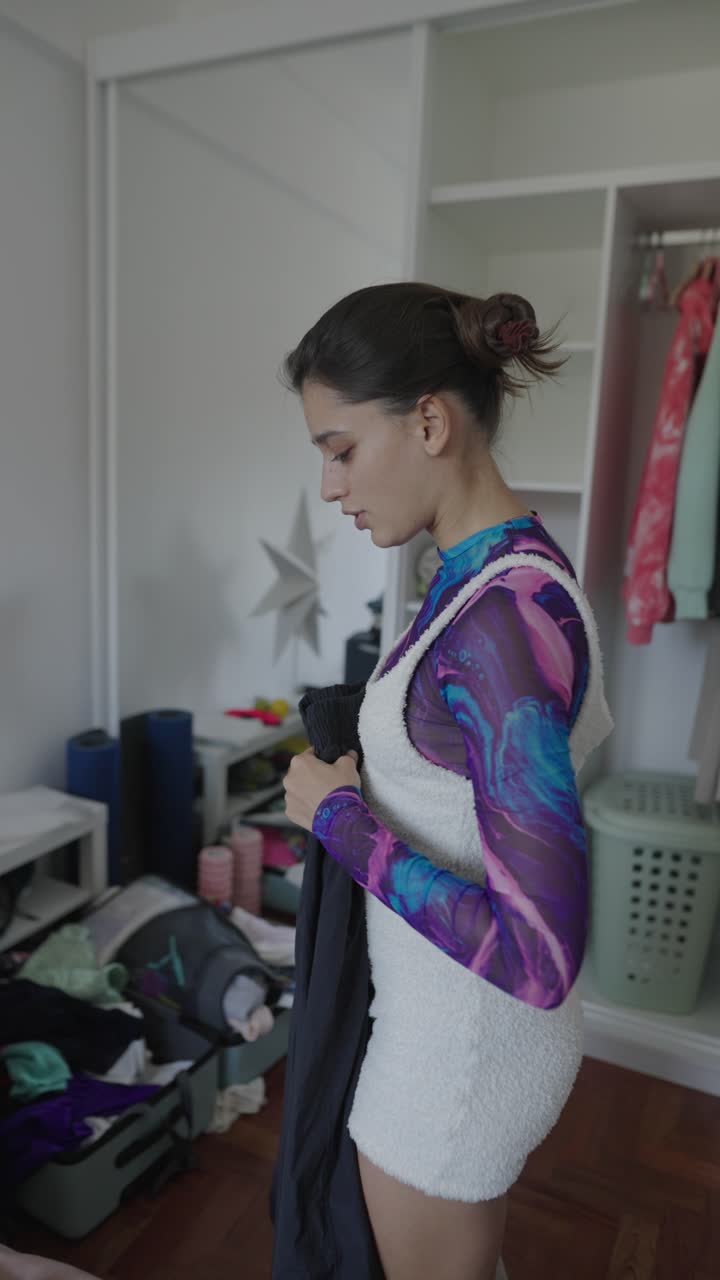 Young woman getting ready in her bedroom
