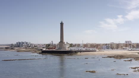 lighthouse and coastal town aerial view