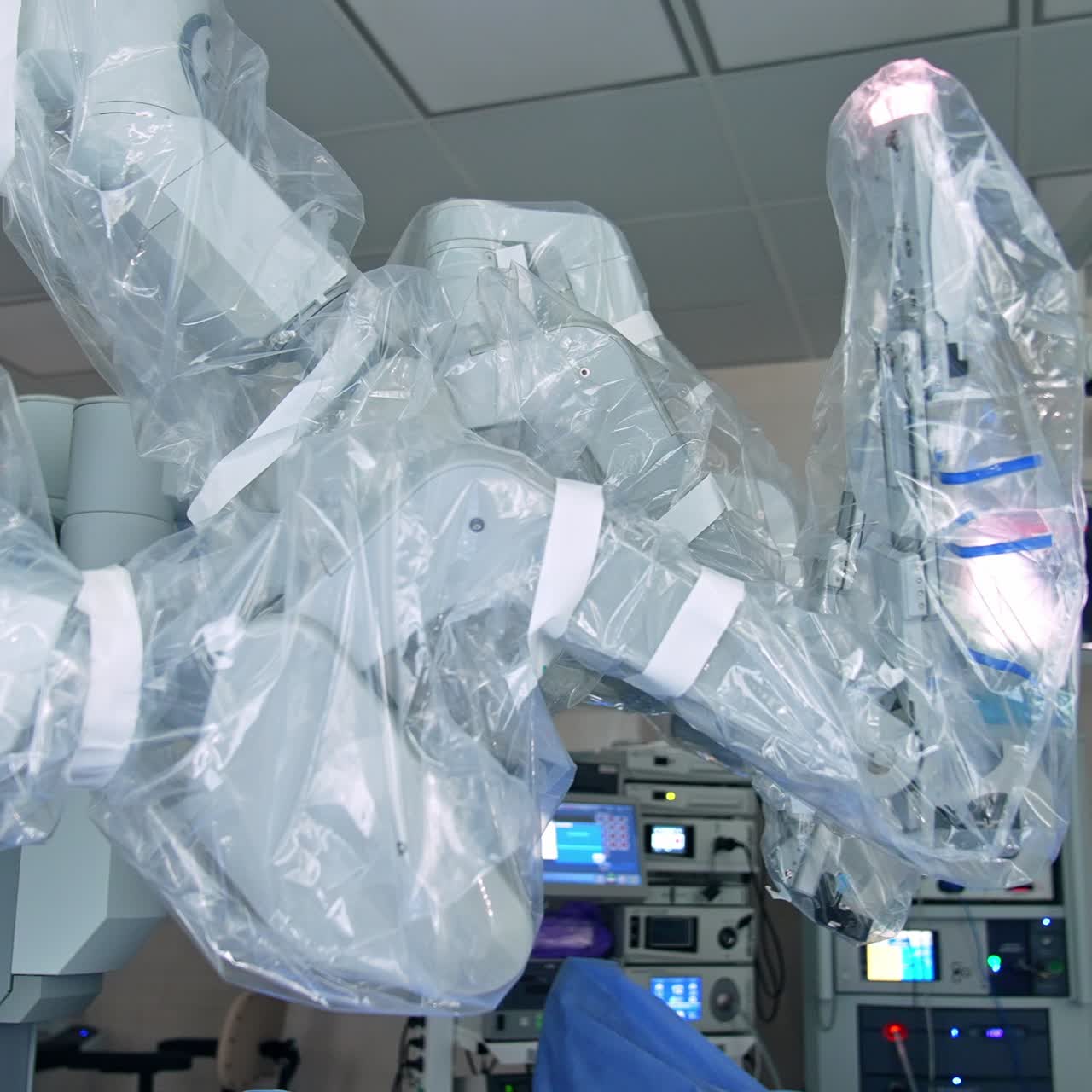 Approaching the robotic equipment for modern operations in up-to-date clinics. Da Vinci robot coated with plastic for sterility. Close up