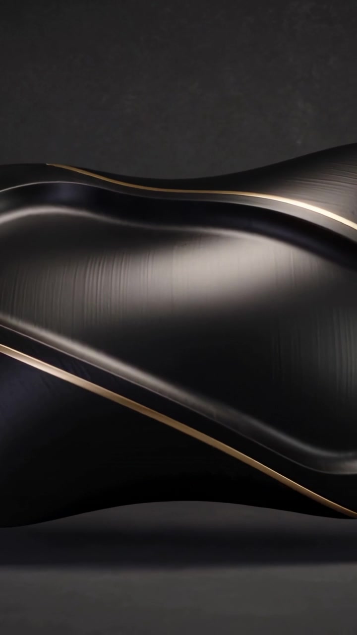 Vertical video: Sliding camera revealing black panel in studio highlighting contours and gold trim