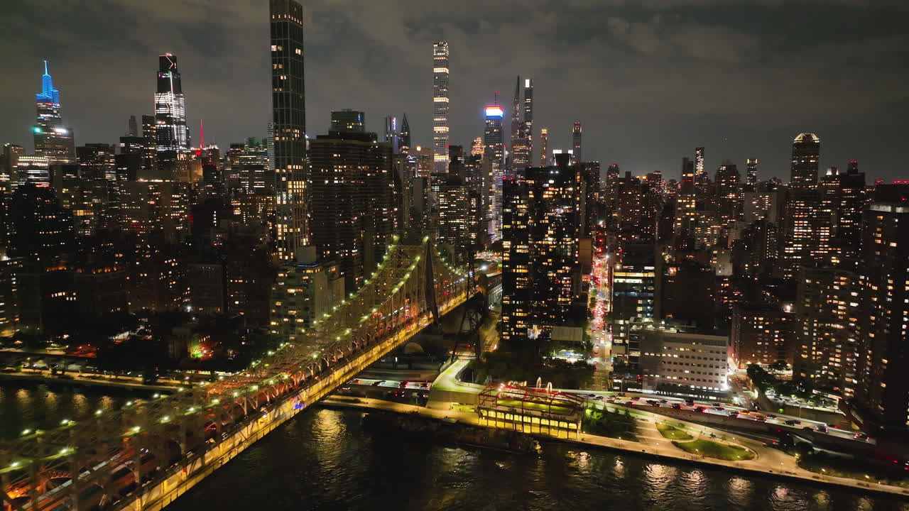 Ed Koch Queensboro Bridge With Manhattan Skyscrapers At Night - Aerial Drone Shot