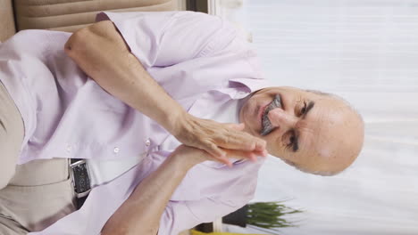 Vertical-video-of-Old-man-experiencing-joy-looking-at-camera.