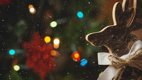 animation of snow falling over christmas deer decoration