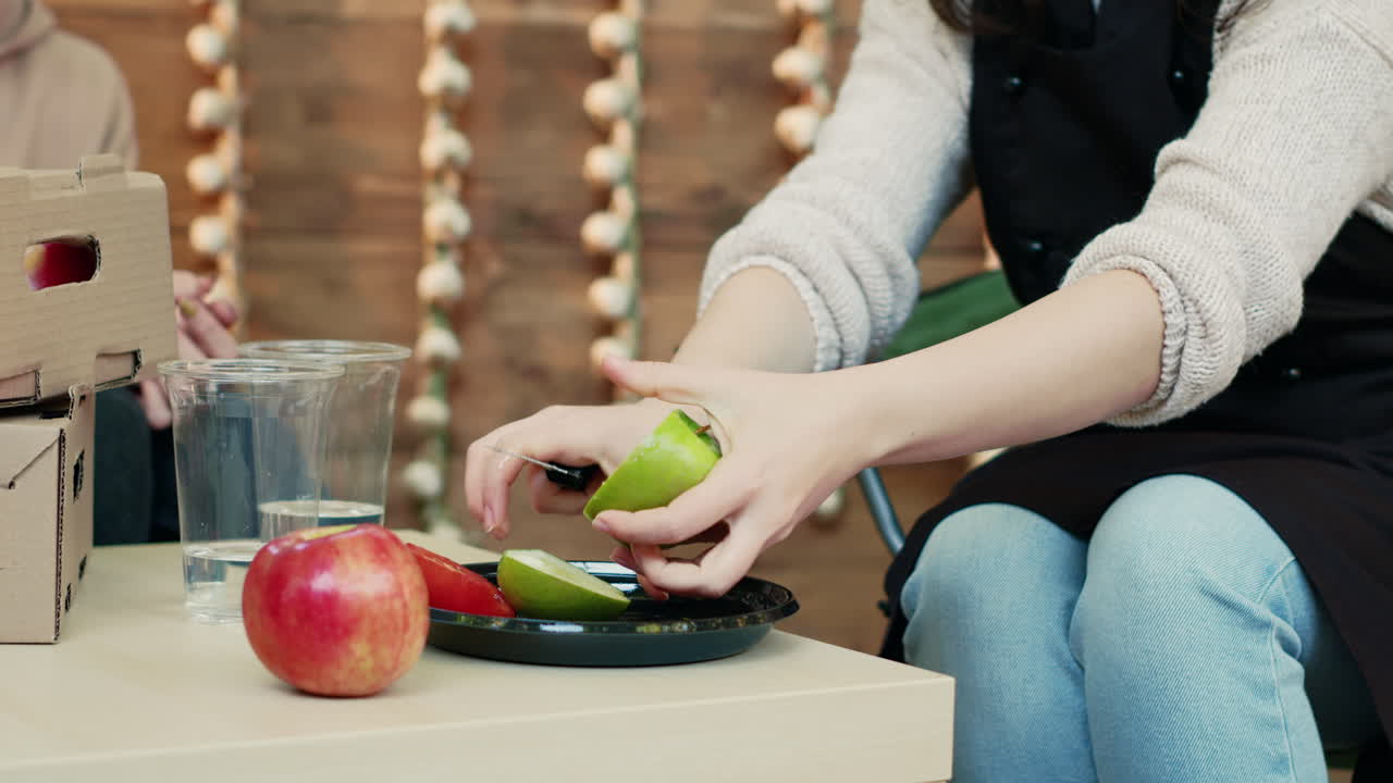 Peeling apples at the farmer's market