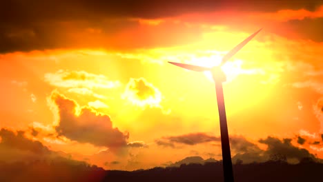 looping animation of silhouettes of wind turbines at sunset.