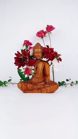 buddha statue with flowers