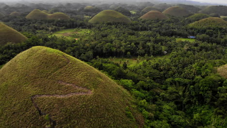 aerial panning view: close up of the chocolate hills in bohol, philippines