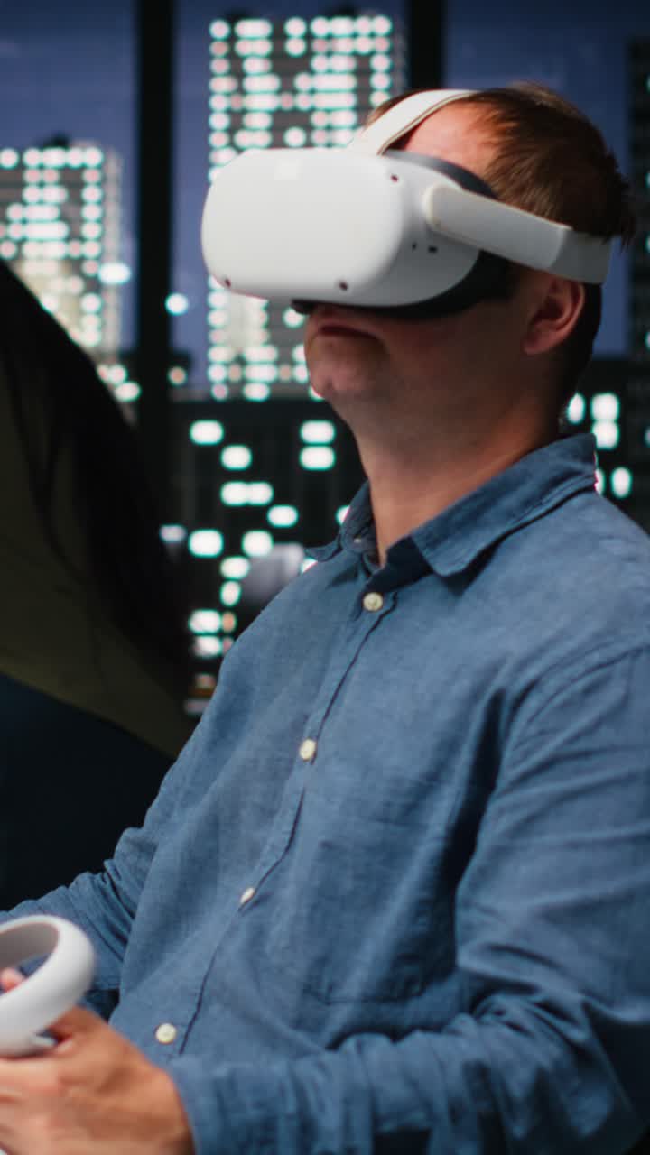 Vertical Video Male game developer using VR glasses and AI tech to design a spaceship