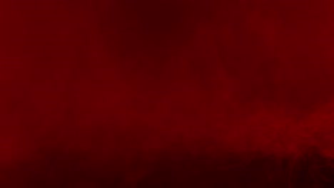Ominous and moody red fog drifts across a black background, creating a sense of horror and suspense. Perfect atmospheric overlay for dramatic or scary visuals