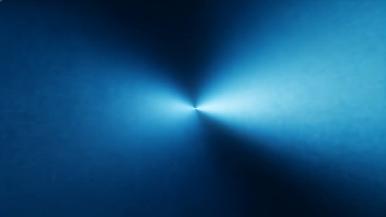 Animazione di un nucleo luminoso con quattro lobi che ruotano e pulsano in senso orario su uno schermo blu per la visualizzazione.