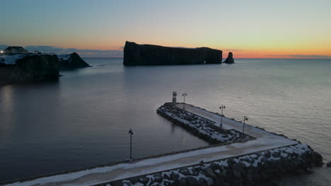 cinematic drone shot of famous perce rock in quebec, canada