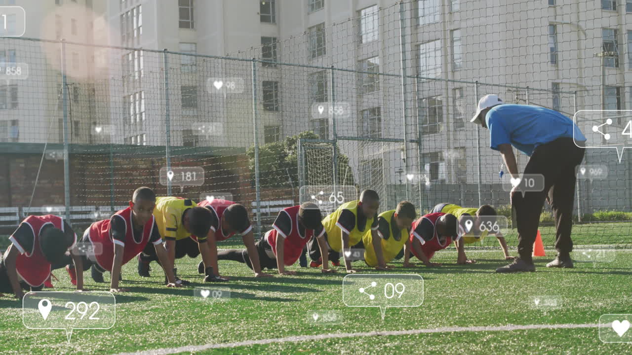 Coach supervising boys doing push-ups on sports training field, displaying floating metric icons