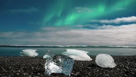 northern lights over the diamond beach with ice in south iceland