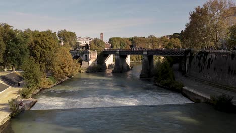 static wide shot for the water falls of the tiber river of rome