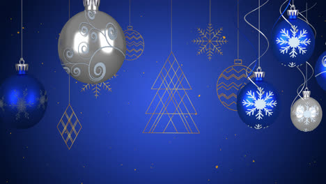 animación de navidad bolas azules y plateadas y decoraciones colgando con la nieve cayendo