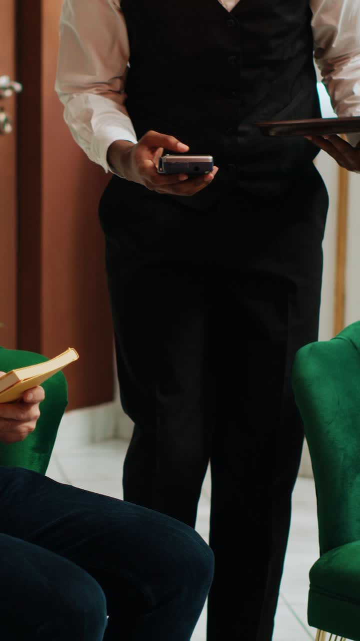 Vertical Video Elderly person paying for coffee cup