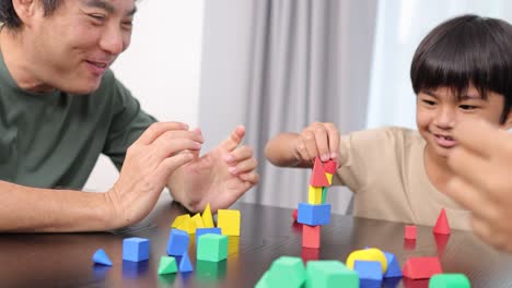 a family enjoys building with colorful blocks, fostering creativity and connection in a bright, cheerful setting