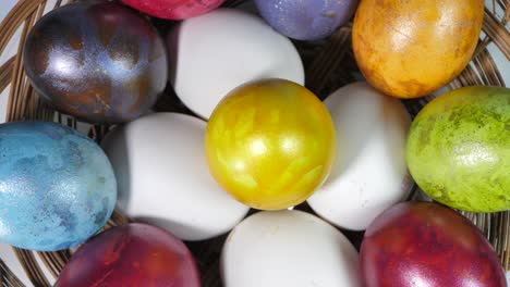 colored eggs rotate in a basket