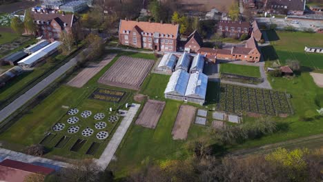 University-red-brick-building-Magic-aerial-top-view-flight-Berlin-Greenhouse-Dahlem-Centre-of-Plant-Sciences