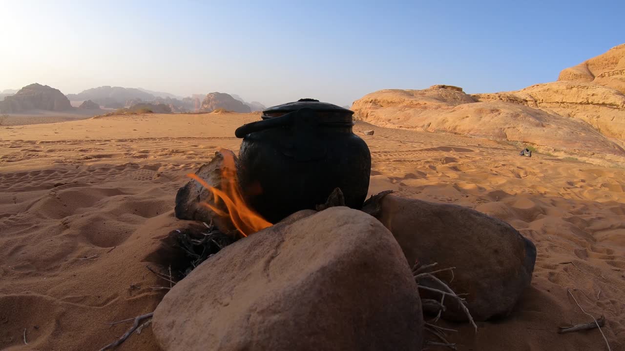 Tea kettle on campfire in Wadi Rum desert, Jordan