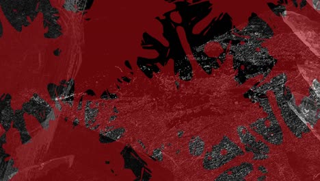 animación de salpicaduras de pintura roja sobre texturas orgánicas grises en movimiento sobre fondo negro