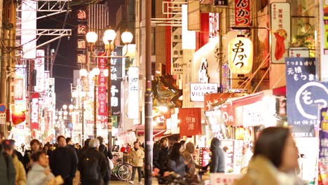 crowded evening market with vibrant lights and signs