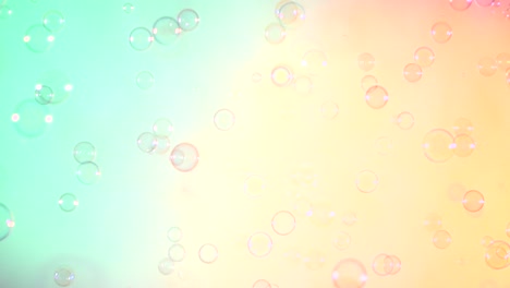 blue and clear soap bubbles on turquoise and pink background a lot of blue and clear soap bubbles isolated on turquoise and pink background