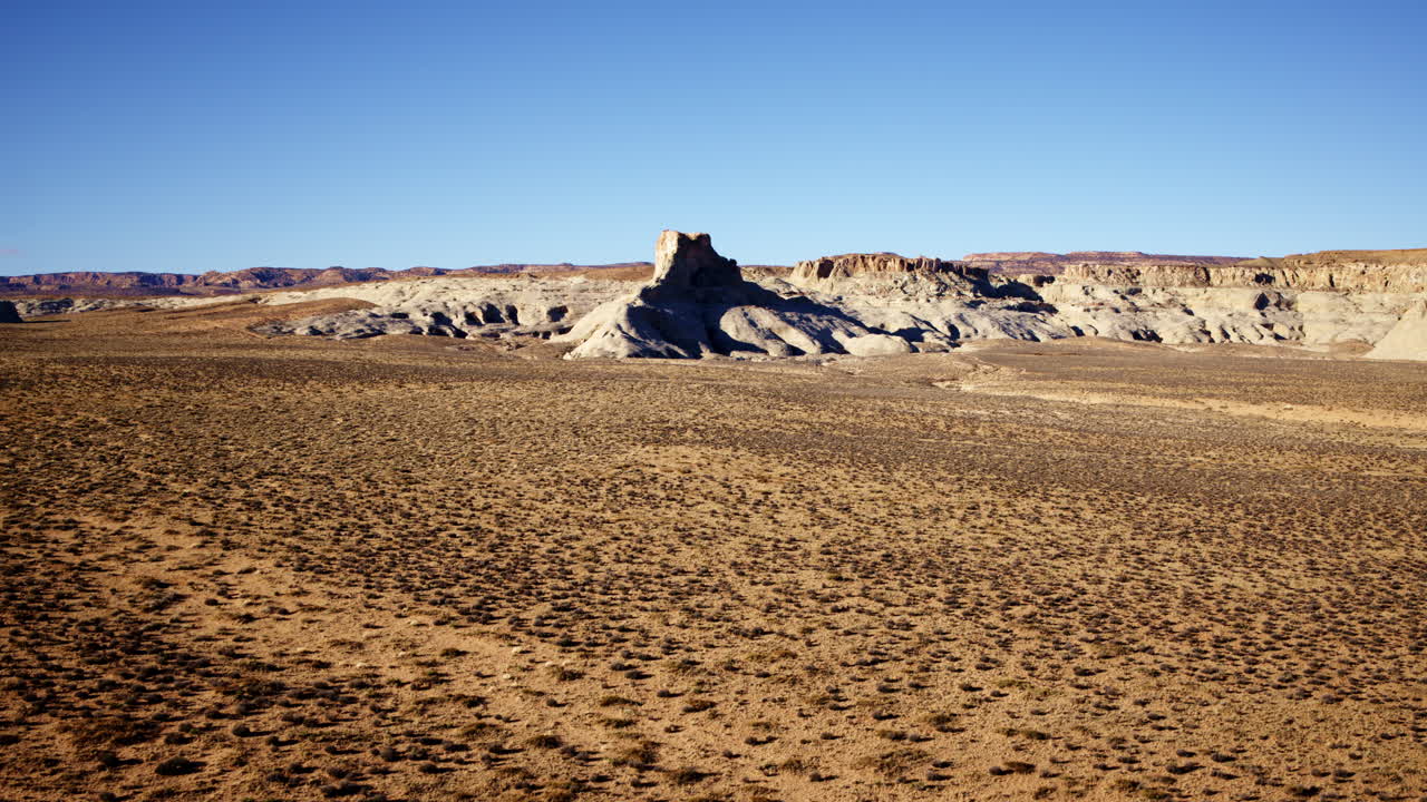 Aerial footage drifting above the sculpted beauty of red canyon rock formations.