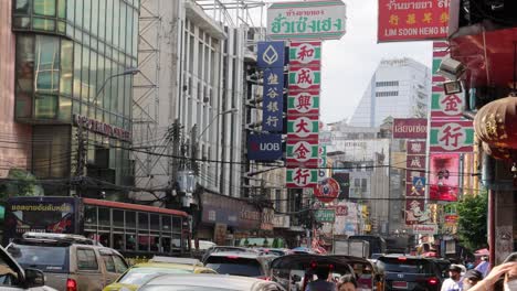 traffic and pedestrians in a busy cityscape