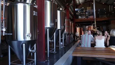 group of friends enjoying a brewery tour together