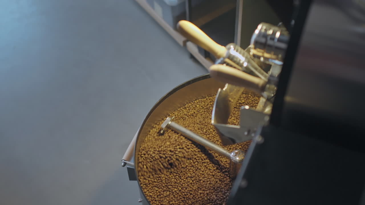 Roasting Coffee Beans in Metal Drum Baskets with Large Metal Furnaces, Mixing with Turning Blades in slowmo