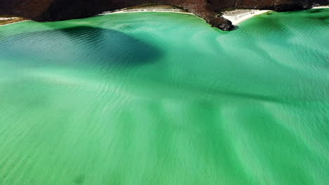 beautiful green shallow waves of balandra beach in baja sur, mexico -aerial