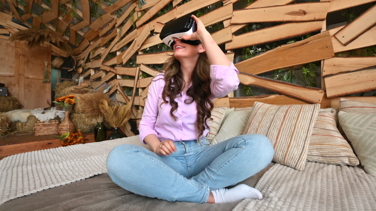 Woman looking thorough VR headset and being impressed