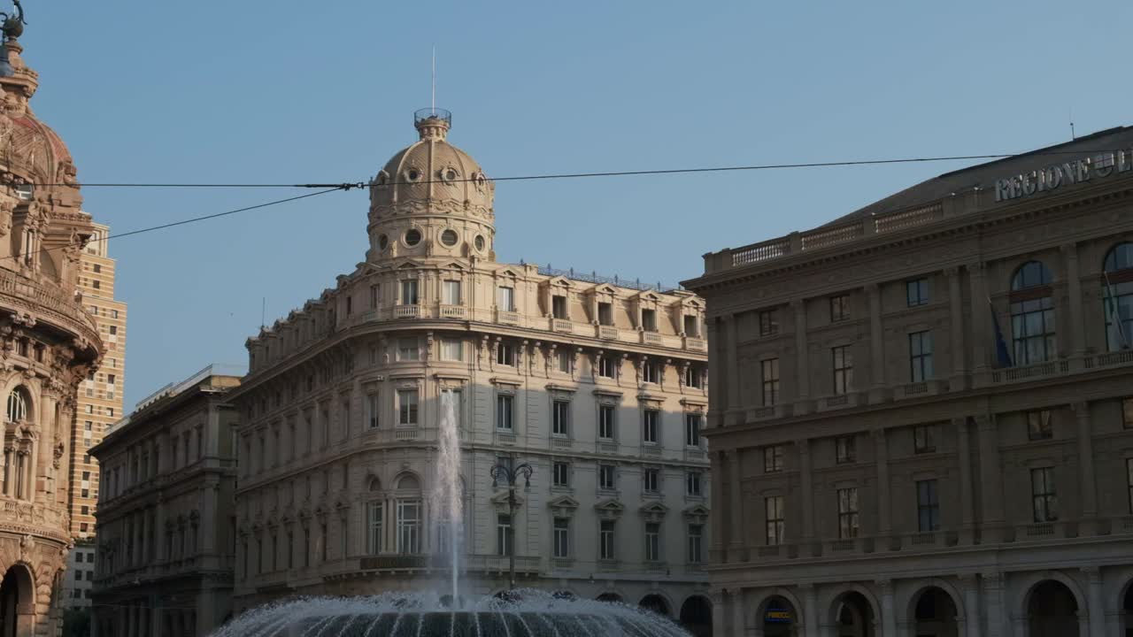 Slow motion view of De Ferrari square in Genoa, city main square, with the beautiful fountain.