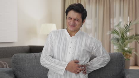 Sick-Indian-man-having-back-pain