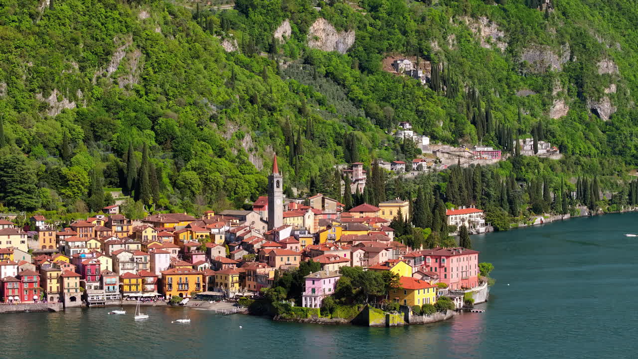 Aerial drone view of Church of S.Giorgio surrounded by houses in Varenna, Italy