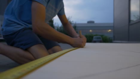 measuring plywood with tape measure 4k