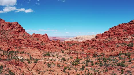 cinematic drone shot , aerial view of the rugged cliffs and desert landscape of utah, moab, usa