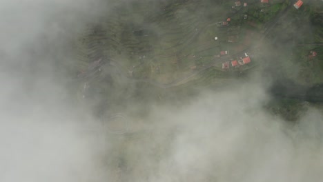 Clouds-obscure-view-of-green-terraces-on-rural-mountains-of-Madeira