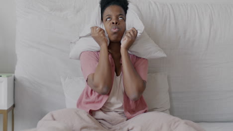 woman annoyed by noise in her bedroom