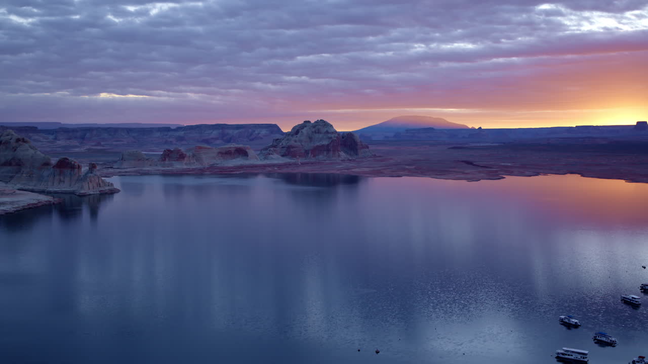 A breathtaking aerial view captures Glen Canyon’s unique sandstone formations, bathed in golden light.