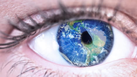 globe over close up of female eye against white background