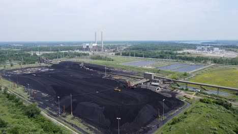 Grader-working-a-pile-of-coal-for-the-DTE-Belle-River-Power-Plant,-in-East-China,-Michigan,-USA