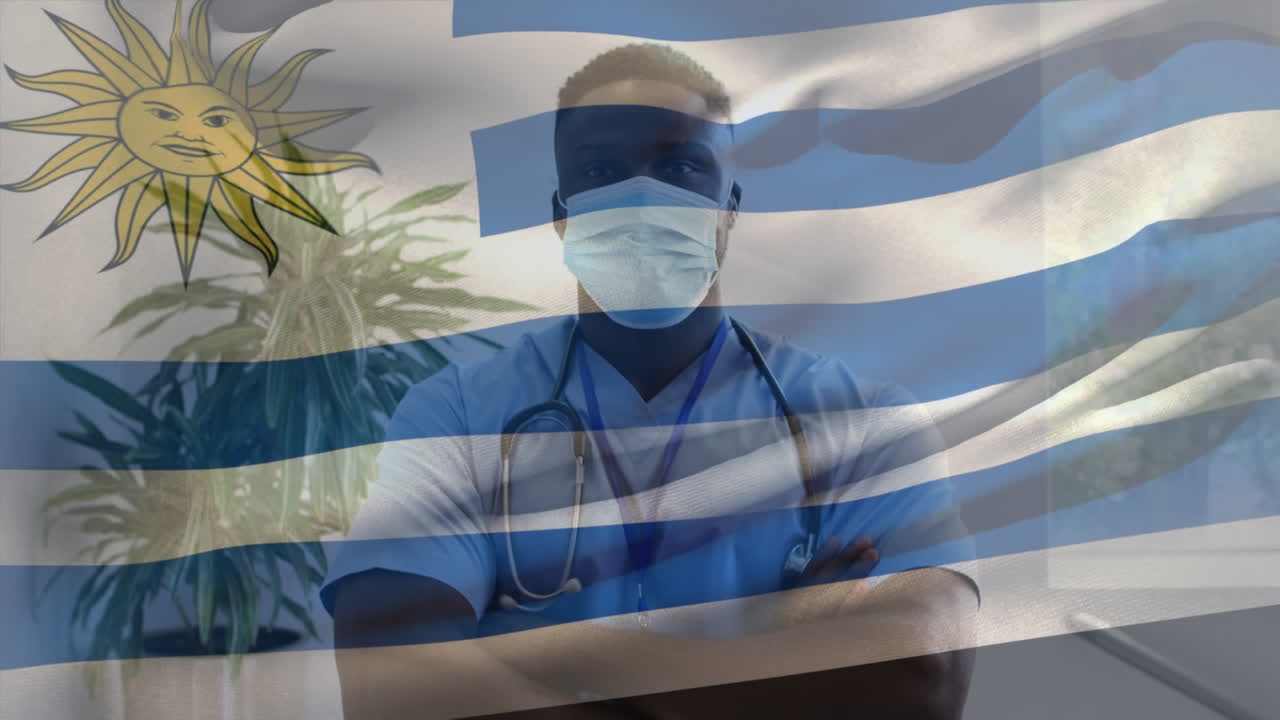 animación de la bandera de uruguay ondeando sobre el médico con máscara facial
