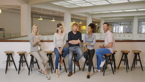 Colleagues-listening-to-woman