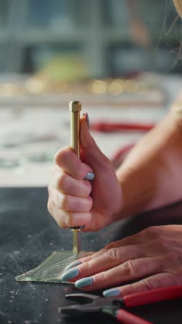 woman cutting glass